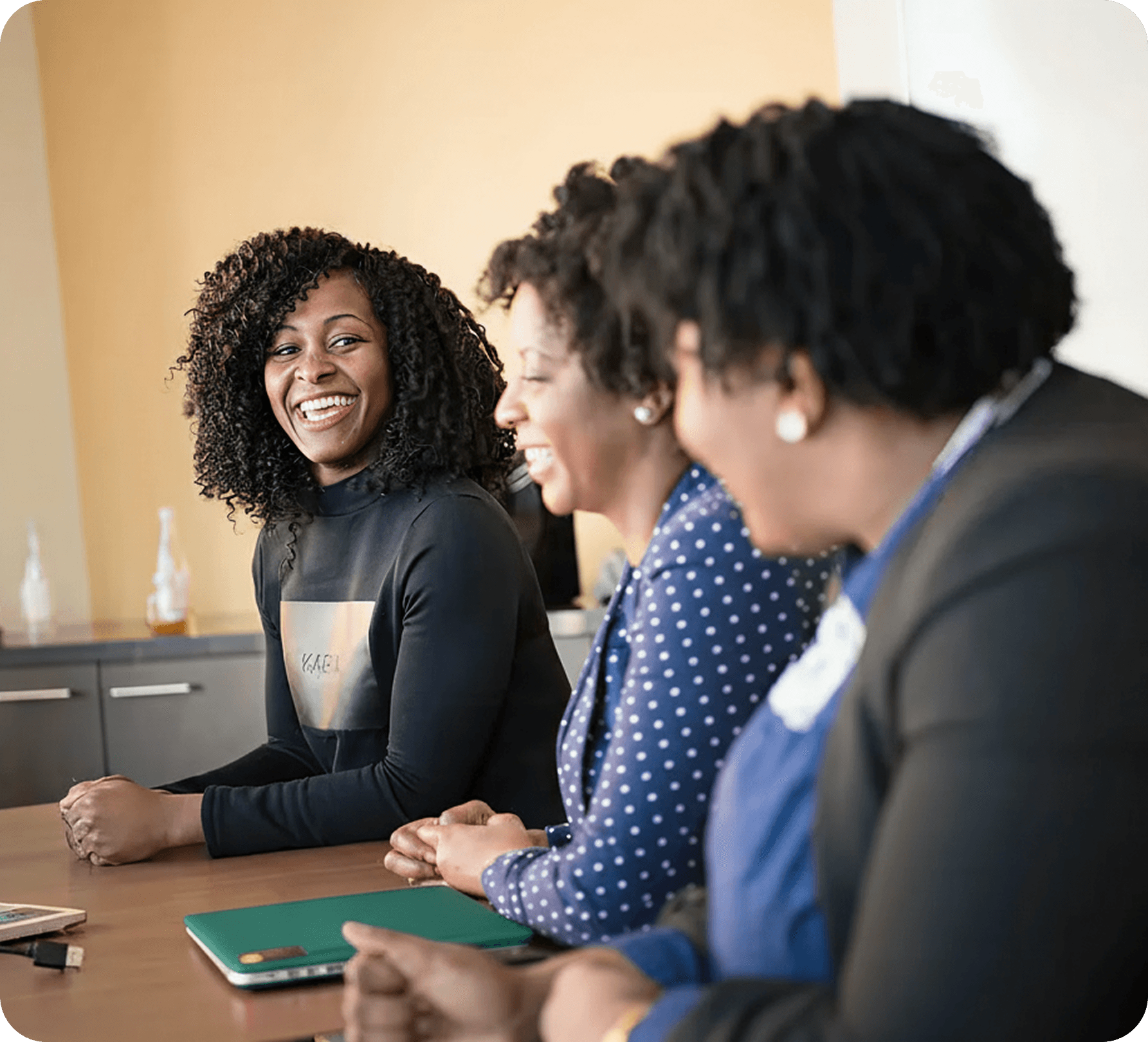 School mental health team smiling together at a table