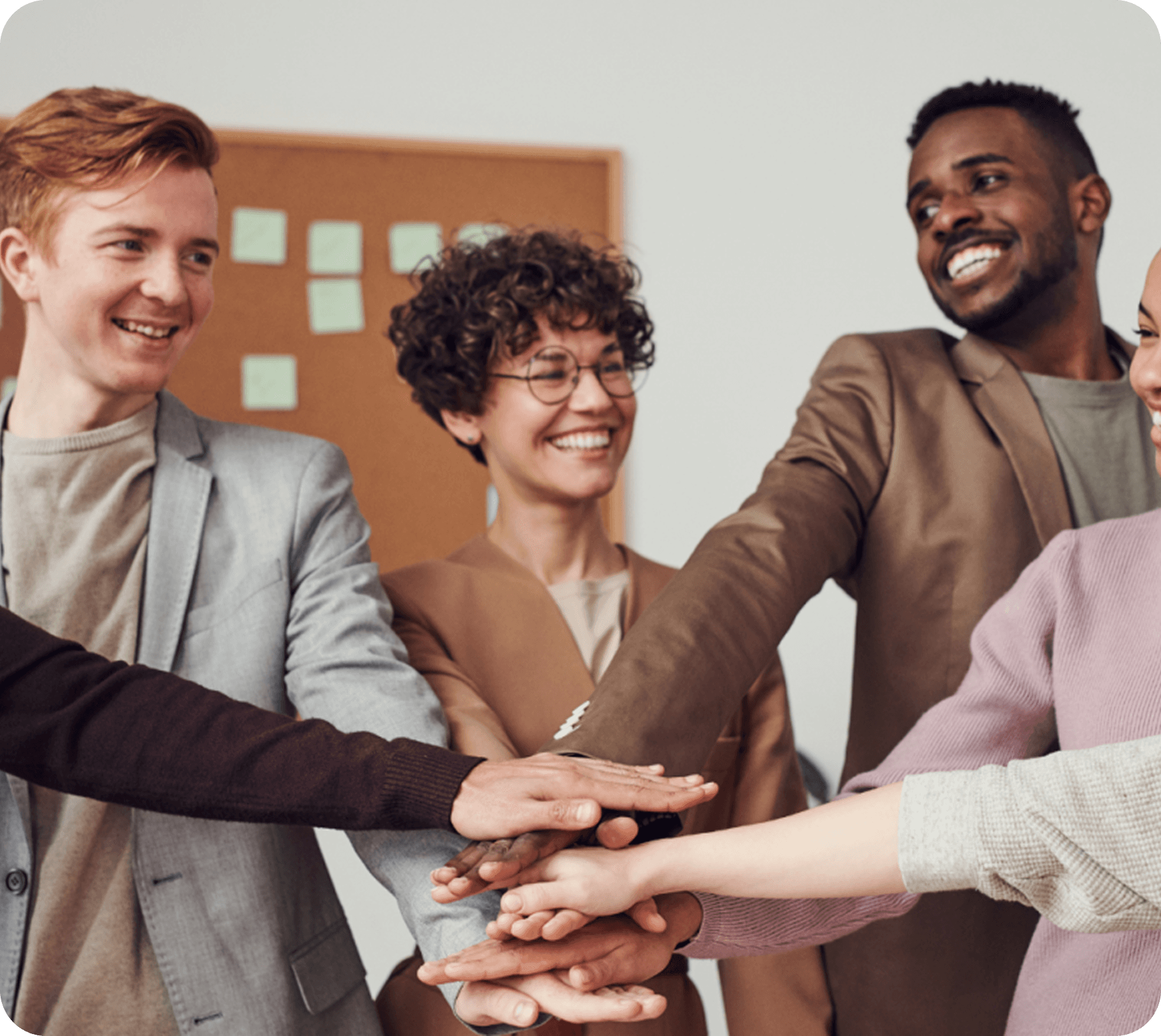 Team members joining hands together